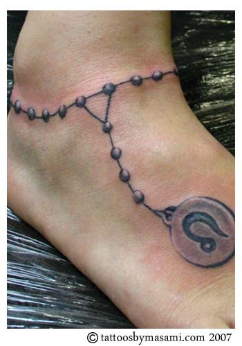 Rosary Bead Tattoo on Foot. We have all seen Rosary Beads around the wrist 