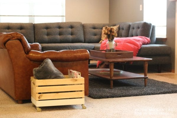 A beautiful multi-purpose display box with gold accents that's ideal for magazines, blankets, and toys!