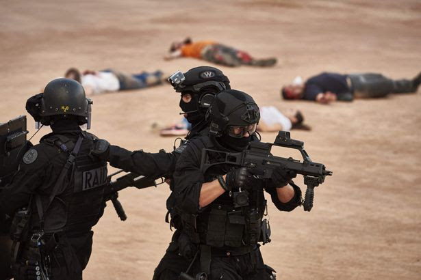 Police forces take part in a mock suicide attack exercise as part of security measures for the upcoming Euro 2016 football championship, at the fan zone in Lyon