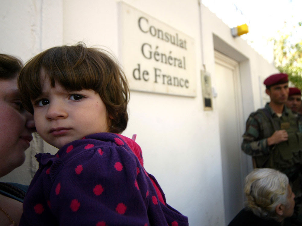Iraqi Christians hoping to emigrate to France wait outside French Consulate in Irbil