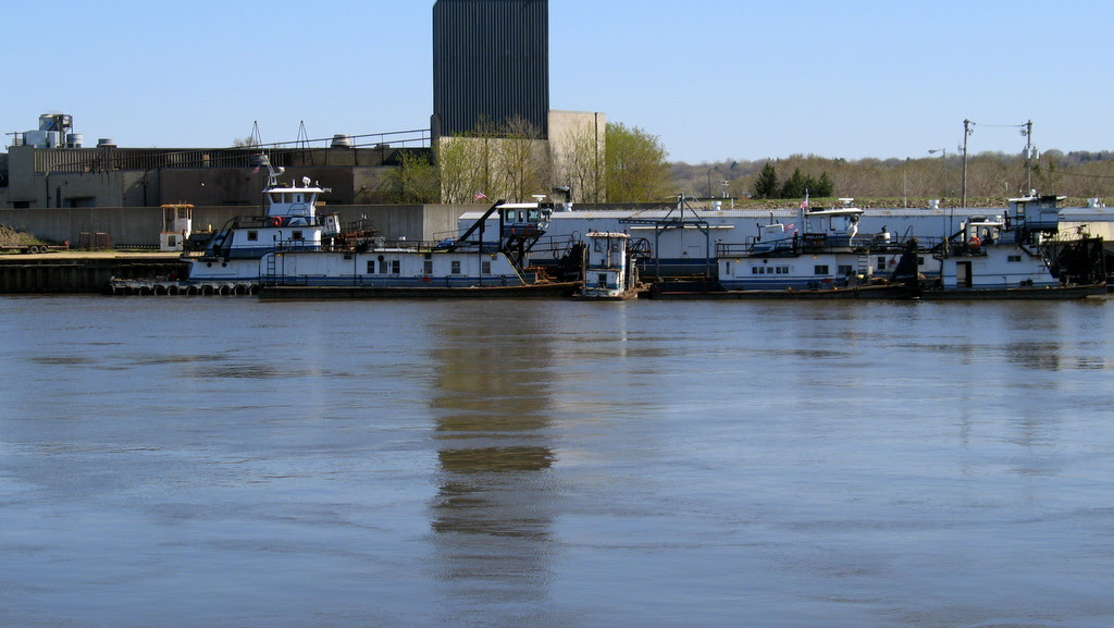 Tugboats lined up along shore of the Mississippi River near downtown St Paul.