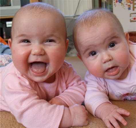 cute twin baby girls smiling