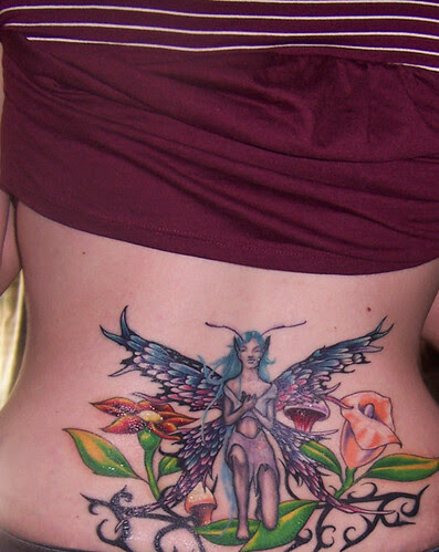 Girl sexy with Lower back fairy tattoo 