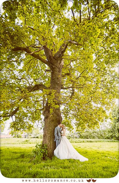 Bride and groom under large tree, Suffolk - www.helloromance.co.uk