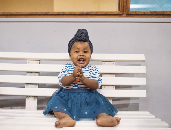 She's famous for being seriously adorable and wearing these super-fly headwraps, which are available for purchase on her online store.