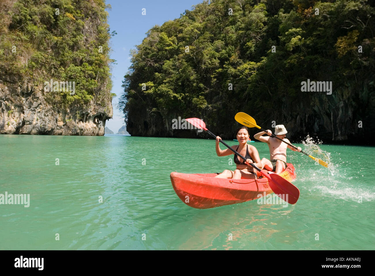 Couple kayaking Ko Hong Island lagoon Phang Nga bay Krabi