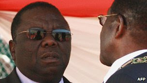 Zimbabwean President Robert Mugabe (C) and his wife Grace (R) chat with the Prime Minister Morgan Tsvangirai (L) at the National Sports Stadium in Harare on August 10, 2010