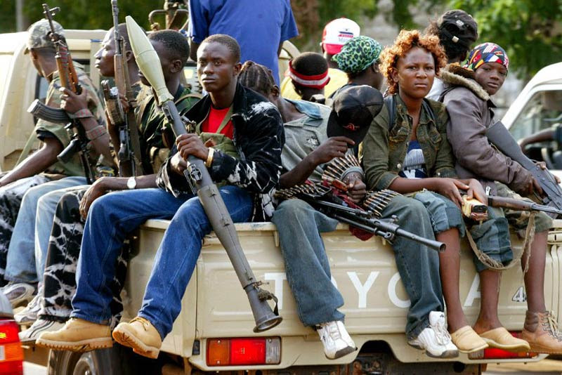 Image result for young  african rebels holding guns