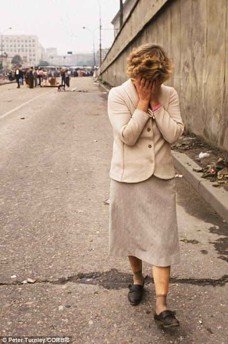 People gather to mourn the three victims of the attempted coup at various impromptu memorials around Moscow in 1991