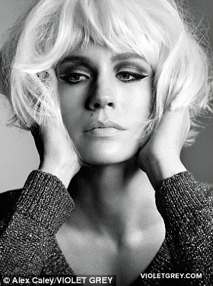 I'm ready for my close-up: January appears to channel tragic Hollywood icon Marilyn Monroe, her cropped blonde bob gently teased by the actress as she cups her face in both hands...