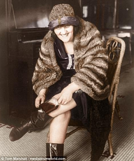 Throughout the ban, Americans found sneaky ways to drink and sell alcohol, and many attended parties at speakeasies, or secret bars that served liquor. Pictured above, a woman pulls a pint of alcohol out of her boot