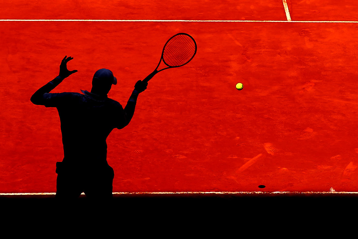 John Isner of the United States plays a forehand against Teymuraz Gabashvili of Russia in their first round match at the Mutua Madrid Open tennis tournament.