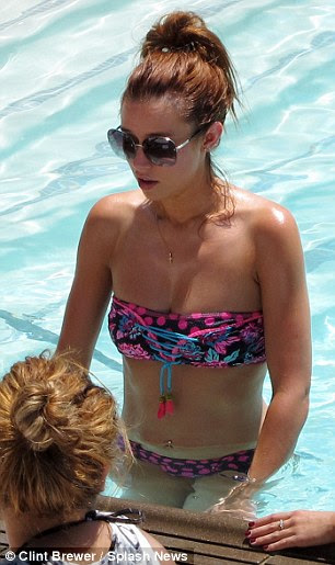 The yummy mummy: Una Healy showed off her post-pregnancy summer body in strapless multicoloured bikini