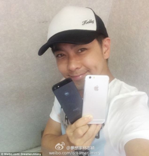 Former Taiwanese pop star Jimmy Lin who also leaked the iPhone 5 and the iPad Mini ahead of their releases, shown with the iPhone 6 shell (right)