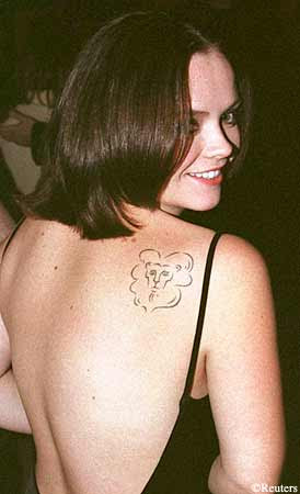  of nine number one singles. She's also the proud owner of seven tattoos!