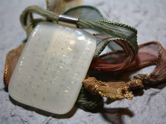 It is difficult to capture how stunning the cabochon is on this pendant - it has been made with ivory glass with a double layer of clear iridescent on top, laid up to form a subtle checkered effect