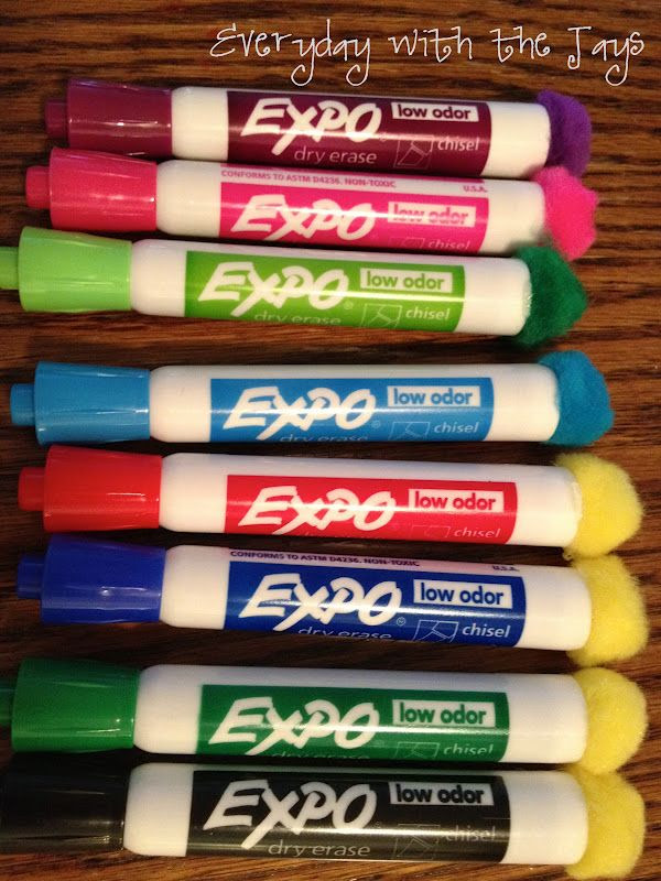 Hot glue Pom poms to dry erase markers. Instant eraser! Dark colors work best. :)