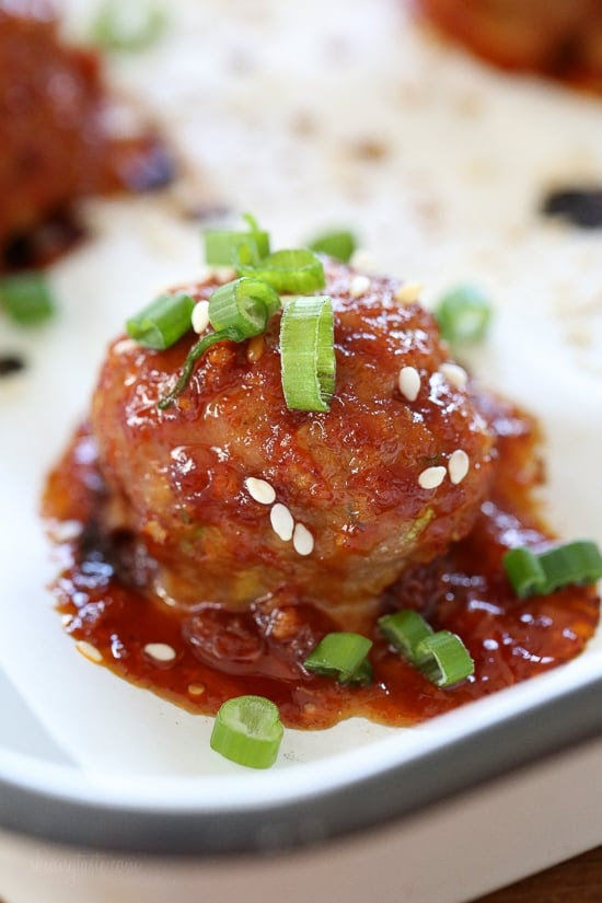 These turkey meatballs are seasoned with ginger and spices and finished with a sweet and spicy, gochujang glaze. These are great as an appetizer or serve them with brown rice to make them a meal.