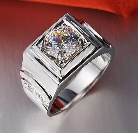The 18 karat gold tiny open heart ring is set with ten 1mm white diamonds. 2CT Brilliant Simulate Diamond Men Engagement Ring