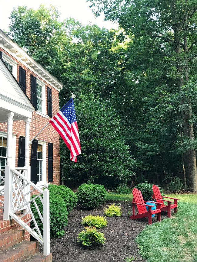 patriotic front porch on brick colonial home outdoor chairs