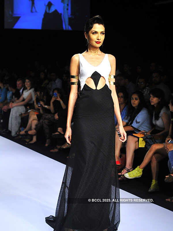 A model showcases a creation by designer Arpan Vohra on Day 2 of the Lakme Fashion Week (LFW) Summer Resort 2013, held at Grand Hyatt, Mumbai, on March 22, 2013. <br /> <br /> <br /> <br /> 