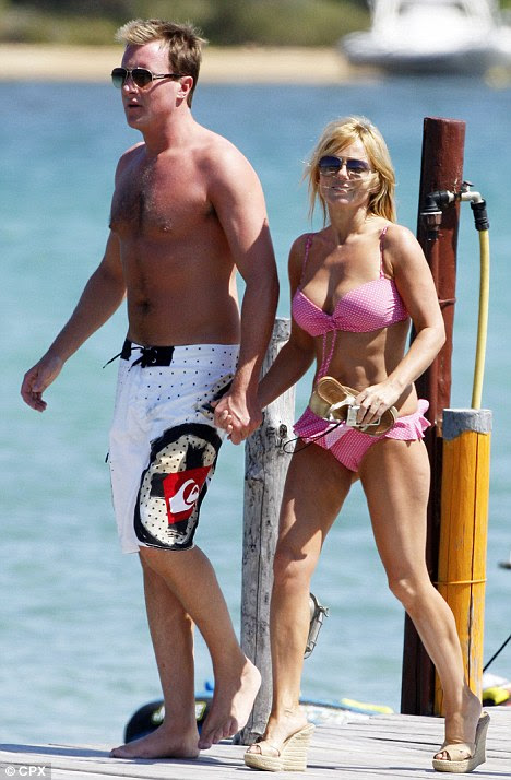 Doomed romance: Just a month before their split, Henry Beckwith and Geri Halliwell were seen holding hands on holiday in Sardinia