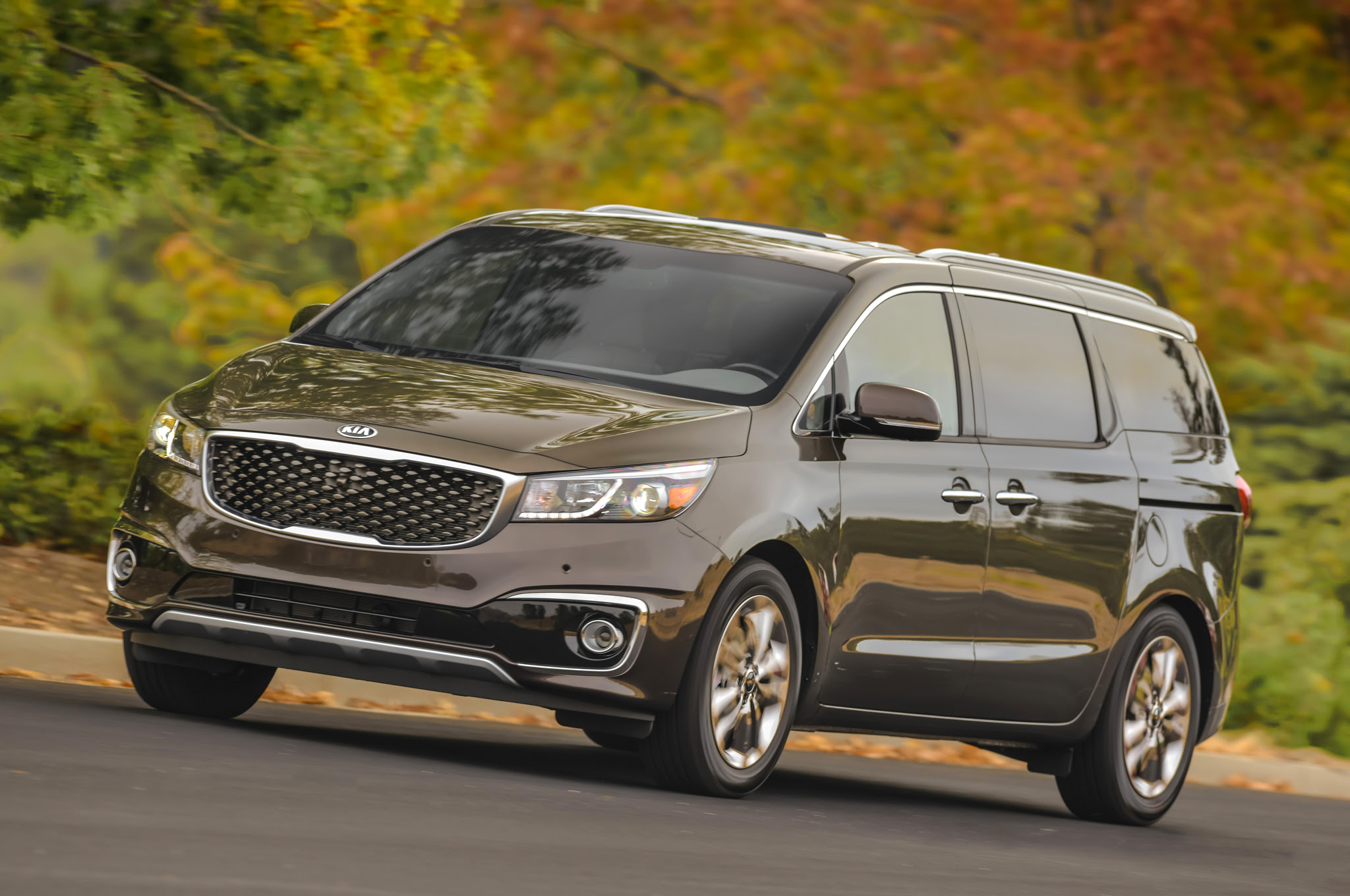 2016 Kia Sedona SXL front three quarters in motion