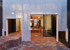 A brick patio and metal screen in a house in Australia.