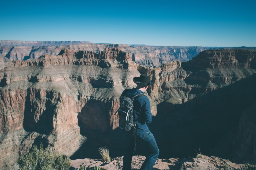 Man Wearing Cowboy Hat Looting At Grand Canyon