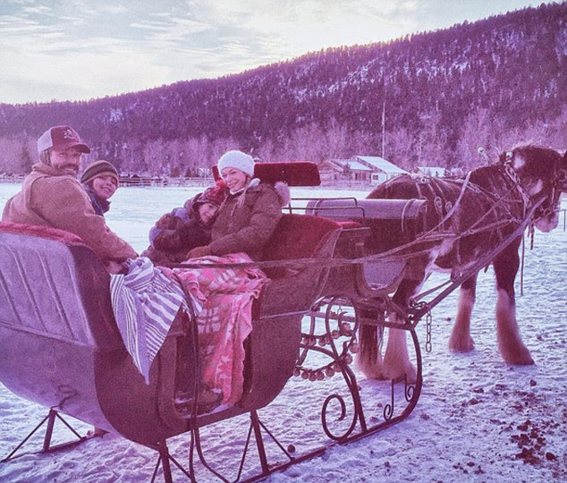 Horse drawn carriage: The country singer on Thanksgiving posted this snap of herself, Eddie and the boys enjoying a ride on a horse drawn carriage