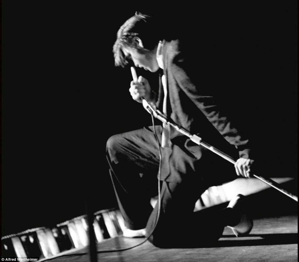 Making history: Elvis already had his signature moved down to a T when he performed at the age of 21 on stage at the the Mosque Theatre Richmond, Virginia in June 1956