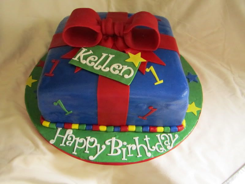 1st Birthday Cake,present cake,blue fondant,red fondant bow