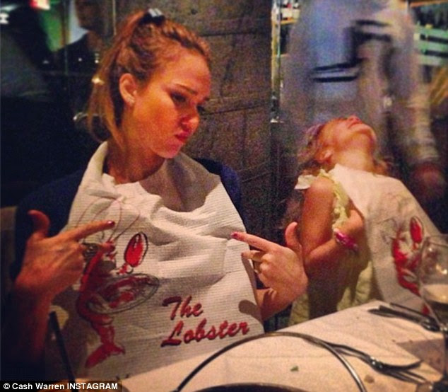 Boasting bibs: The evening before she had a seafood feast with her family at The Lobster 