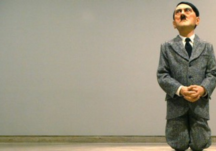 FLASHBACK to 2012: Kit & Kin?:Kneeling Hitler Placed In Warsaw's Jewish Ghetto