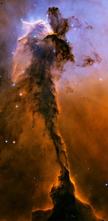 n-a-s-a:

The Fairy of Eagle Nebula - ten light years tall and spewing radiation much hotter than common fire. The greater Eagle Nebula, M16, is actually a giant evaporating shell of gas and dust inside of which is a growing cavity filled with a spectacular stellar nursery currently forming an open cluster of stars.

My mind is trying to absorb the fact that something can be 10 LIGHT YEARS TALL. How does that even make sense?!?