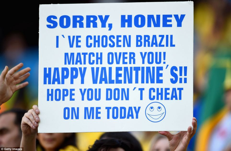 One fan pleaded for forgiveness from his significant other with a giant placard apologising for choosing football over a romantic night with his partner on Brazil's Valentine's Day