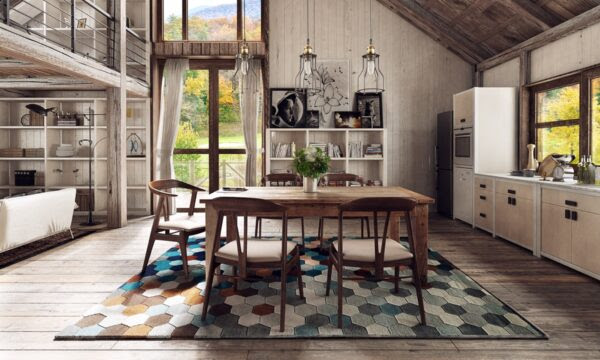 Sloped ceilings and a patchwork rug give this hipster dining room and carefully crafted artistic appeal.