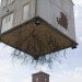 pulled up by the roots, leandro erlich, karlsruhe germany, a city of stars, a city of stars festival, construction art installation, house with roots, house suspended in air, house art exhibit, house art installation