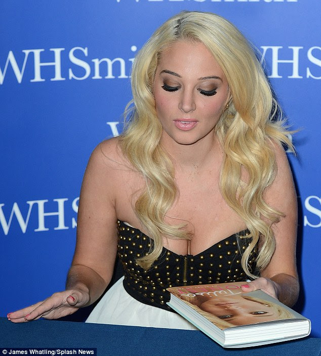 All dressed up: Earlier this week Tulisa went for more angelic numbers as she wore cutesy frocks to her other signings and promotional sessions