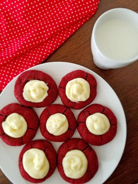 Red Velvet Thumbprint Cookies with Cream Cheese Filling are to die for! Perfect for Christmas, Valentine's Day or a romantic night. Recipe at Remodelaholic.com