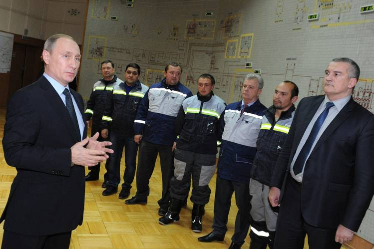 Russian President Vladimir Putin and Crimea head Sergei Aksyonov, far right, at the launching of the first stage of a power bridge linking Russia to Crimea on Wednesday.