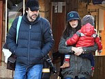Cuddle time! Penelope Cruz hugs her son Leo as she and husband Javier Bardem walk around the nature park Faunia in Madrid in Spain