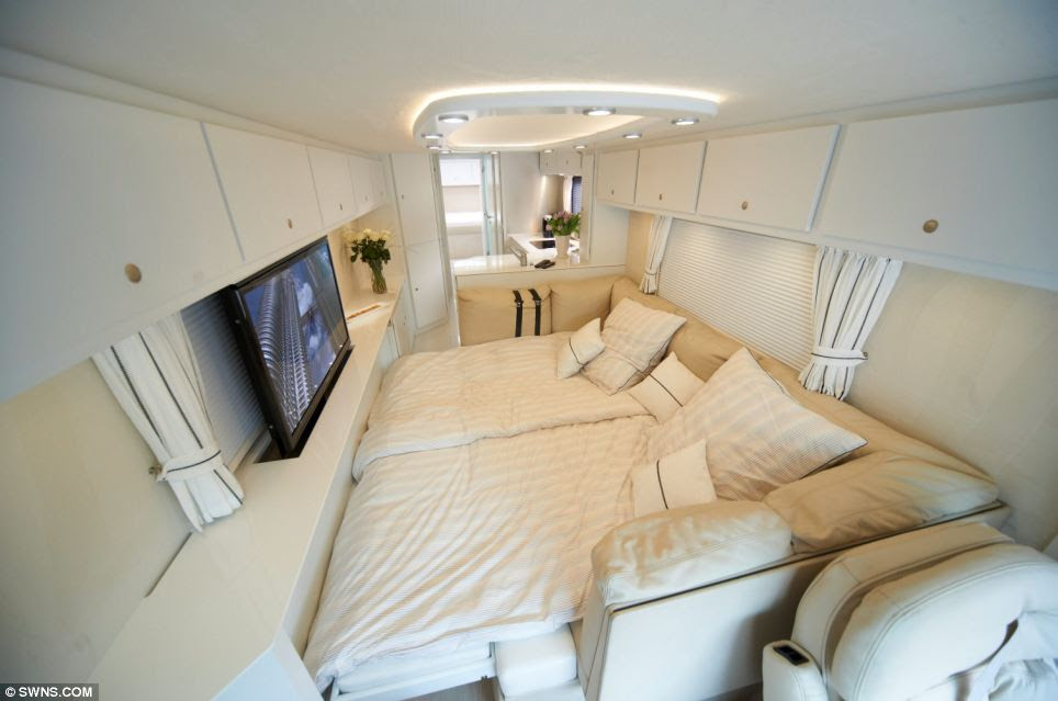 Luxury: Buyers can order the sumptuous interior of their choice. This one's bedroom (pictured) features a wide screen television