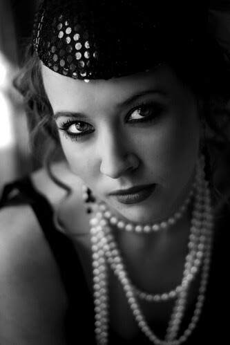 1920s makeup look. heavy makeup, and short