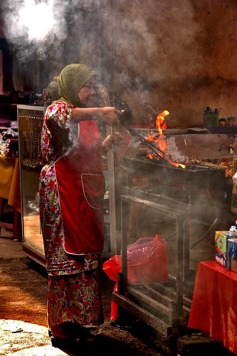 Golden citizen and her satay stall