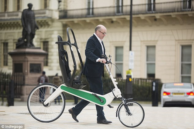 London-based designer claims to have made the world's safest bike. Called the Babel Bike it has a host of features including a roll cage. Crispin Sinclair (shown with the bike) is seeking £50,000 of funding on site Indiegogo. The bike also has foot protectors and an electric motor