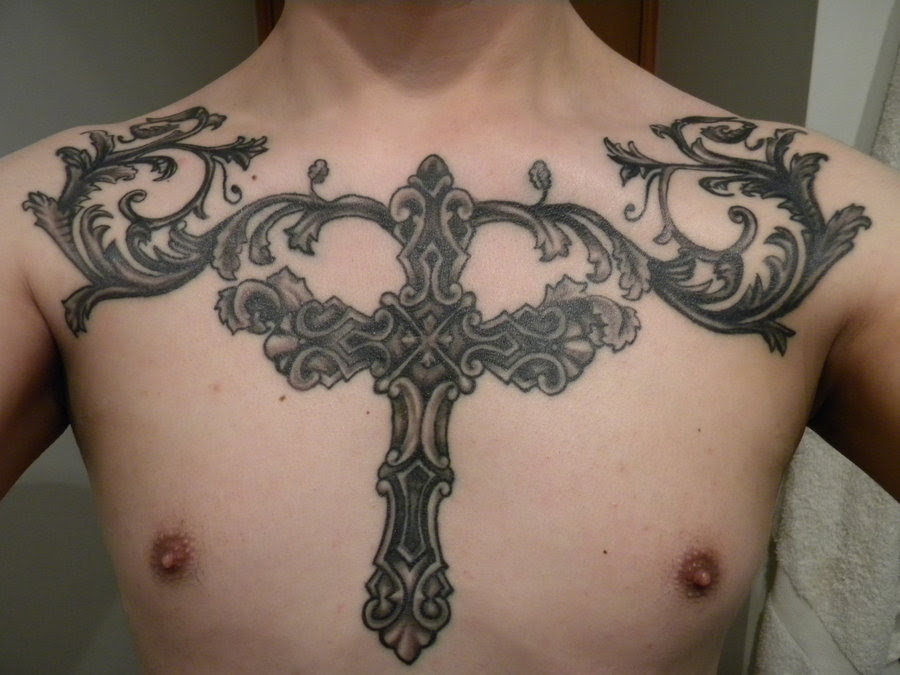  Cross tattoo on his chest 