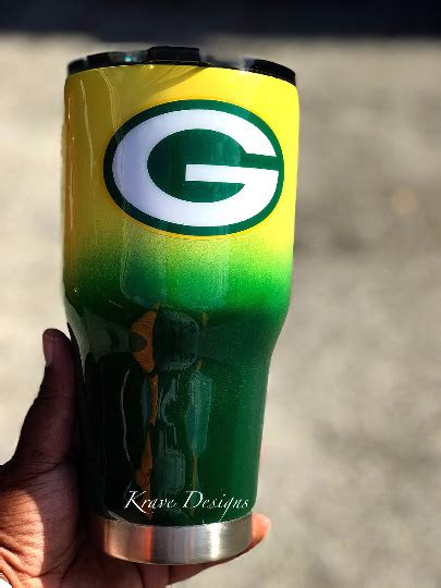 Kitchen sink with stainless steel countertop, wood cabinets, and deep drawers for storage. Green Bay Packers Stainless Steel Tumbler on Storenvy