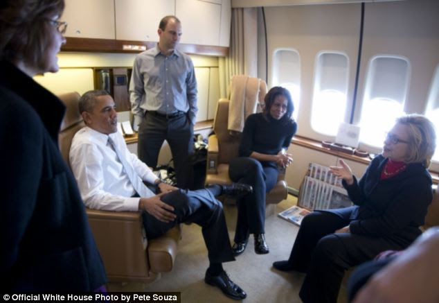 Catching up: Former Secretary of State Hillary Clinton talks with the Obama's and Advisor Ben Rhodes