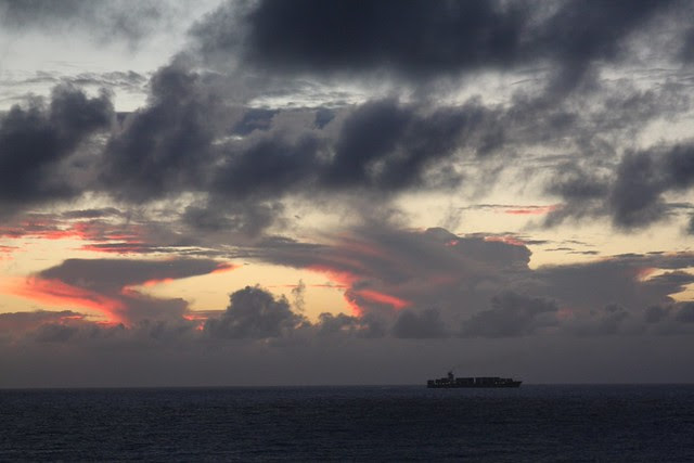 cargo ship at dusk, waikiki
